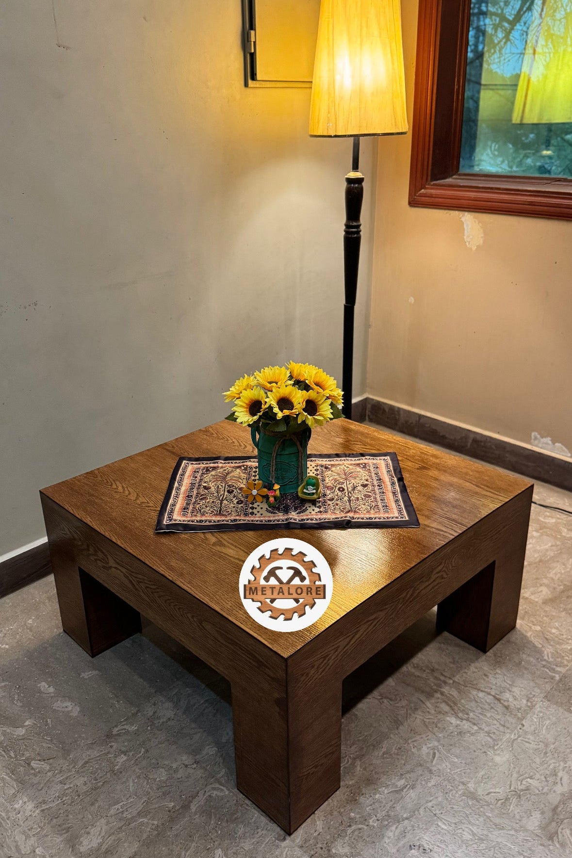 Wide angle view of walnut-finish coffee table with decorative table runner
